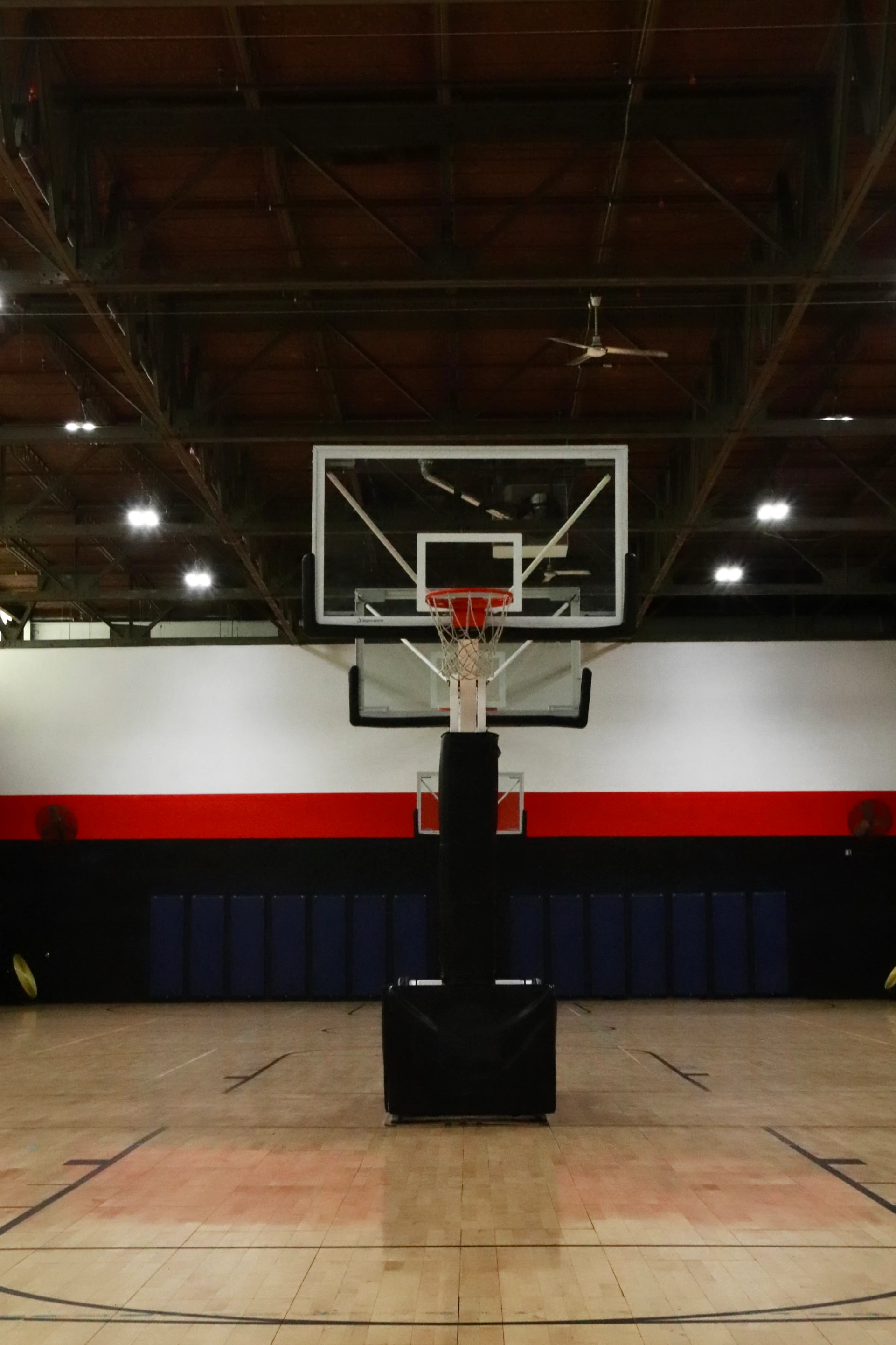 Glass backboard and hoop on the indoor basketball court at XCEL Sports & Fitness in Fairfield, NJ