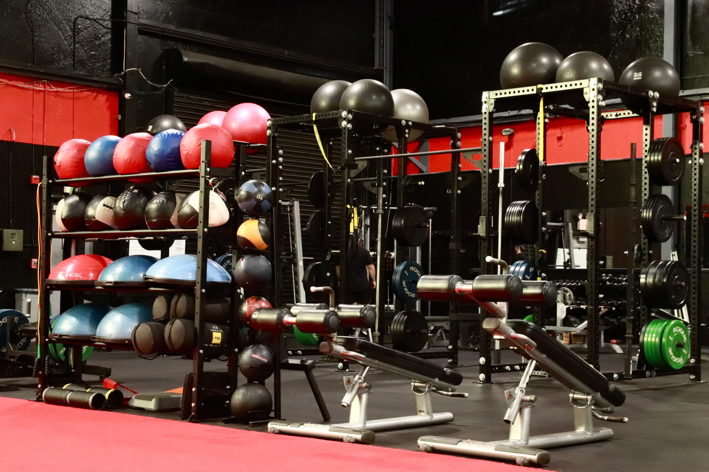 Functional training area with medicine balls, back extension benches and squat rigs at XCEL in Fairfield, NJ