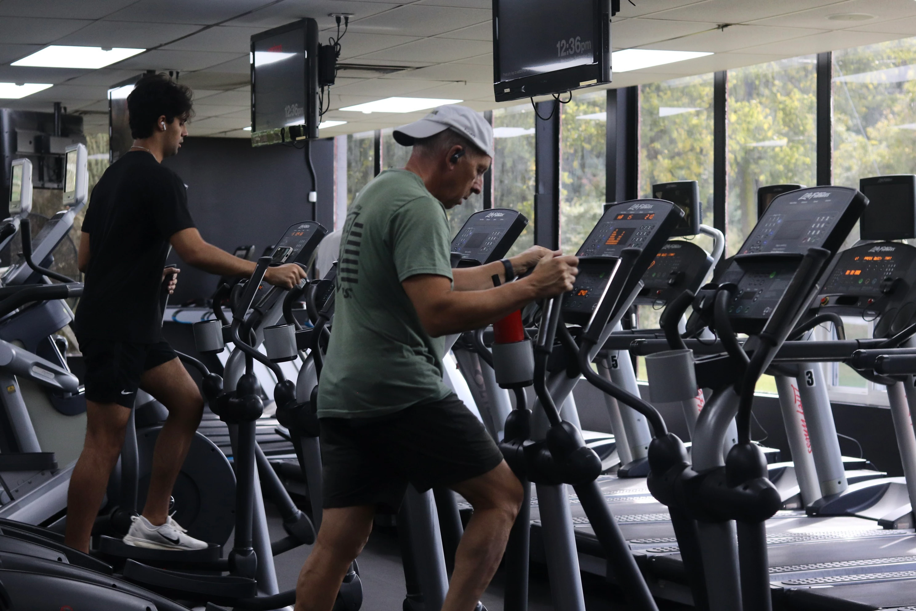 Members working out on ellipticals by the windows at XCEL Sports & Fitness, a gym in Fairfield, NJ