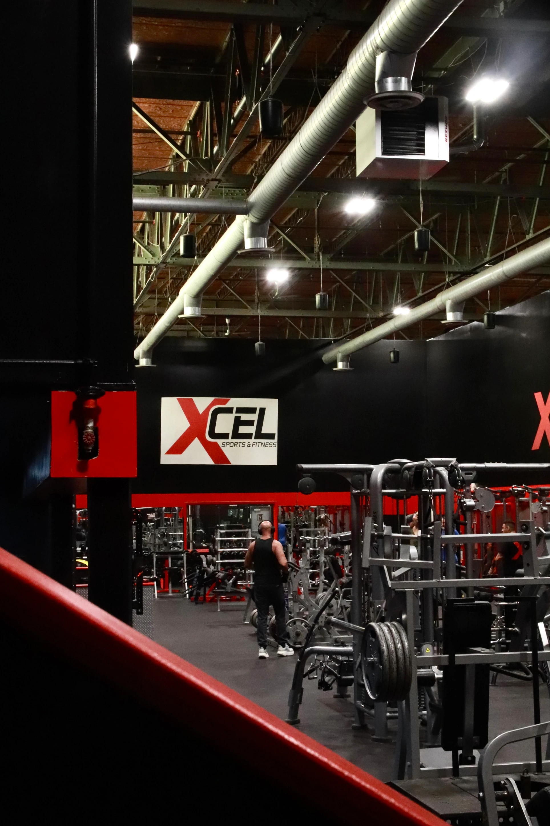 Looking onto the strength floor and the XCEL sign at XCEL Sports & Fitness, a gym in Fairfield, NJ
